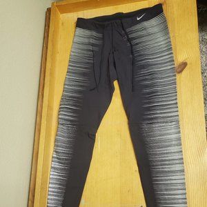 Women's Black and Silver Nike Leggings Size S